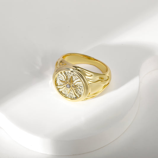 Gold Assyrian ring inspired by ancient Mesopotamian symbols, showcasing cultural heritage